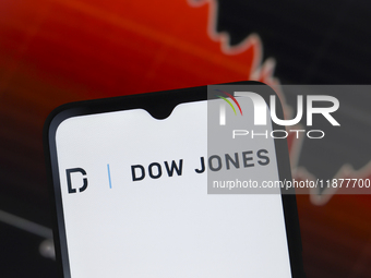 The Dow Jones Industrial Average logo appears on a smartphone screen in this illustration photo in Reno, United States, on December 17, 2024...