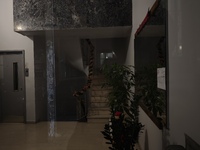 The entrance of an apartment building in Athens, Greece, on December 16, 2024, is decorated with a Christmas garland. (