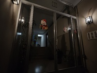 The entrance of an apartment building in Athens, Greece, on December 16, 2024, is decorated with figures of Santa Claus. (