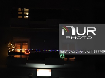 A balcony in Athens, Greece, on December 16, 2024, is decorated with Christmas lights. (