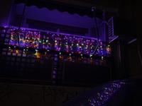 A garland with Christmas lights is on a balcony in Athens, Greece, on December 16, 2024. (