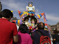 Dozens of people attend a Christmas Village in the Zocalo of Mexico City, Mexico, on December 17, 2024. (