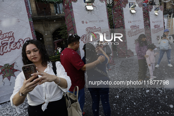 Dozens of people attend a Christmas Village in the Zocalo of Mexico City, Mexico, on December 17, 2024. 