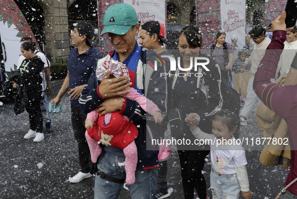 Dozens of people attend a Christmas Village in the Zocalo of Mexico City, Mexico, on December 17, 2024. 