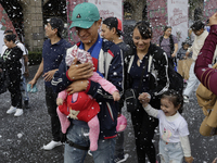 Dozens of people attend a Christmas Village in the Zocalo of Mexico City, Mexico, on December 17, 2024. (