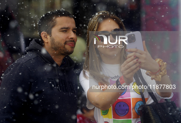 Dozens of people attend a Christmas Village in the Zocalo of Mexico City, Mexico, on December 17, 2024. 