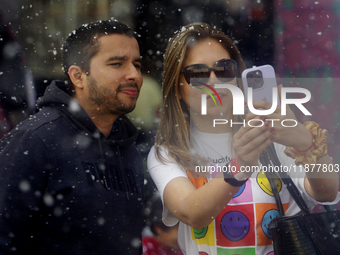 Dozens of people attend a Christmas Village in the Zocalo of Mexico City, Mexico, on December 17, 2024. (