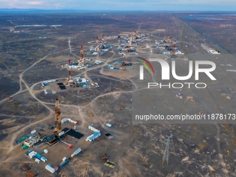 Drilling rigs work in the Gobi Desert in Karamay, China, on July 17, 2024. (