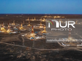 Drilling rigs work in the Gobi Desert in Karamay, China, on July 17, 2024. (