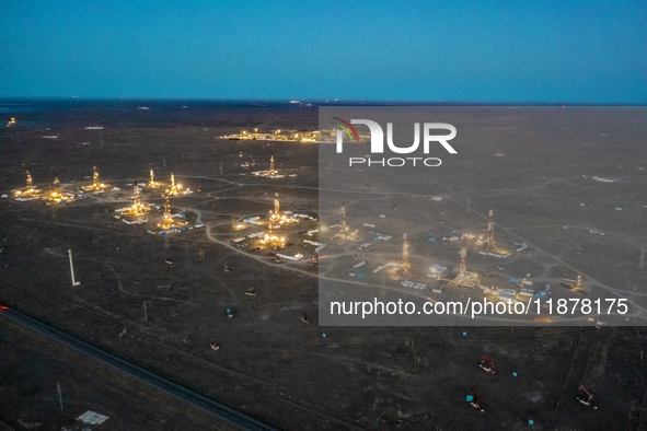 Drilling rigs work in the Gobi Desert in Karamay, China, on July 17, 2024. 