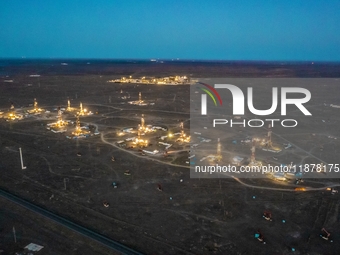 Drilling rigs work in the Gobi Desert in Karamay, China, on July 17, 2024. (