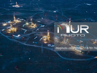 Drilling rigs work in the Gobi Desert in Karamay, China, on July 17, 2024. (