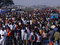 People arrive to attend Prime Minister Narendra Modi's public meeting for the 'Ek Varsh-Parinaam Utkarsh' event, marking the completion of o...