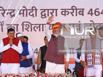 Prime Minister Narendra Modi is with Rajasthan Chief Minister Bhajan Lal Sharma and Madhya Pradesh Chief Minister Mohan Yadav during the 'Ek...