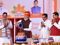 Prime Minister Narendra Modi is with Rajasthan Chief Minister Bhajan Lal Sharma and Madhya Pradesh Chief Minister Mohan Yadav during the 'Ek...