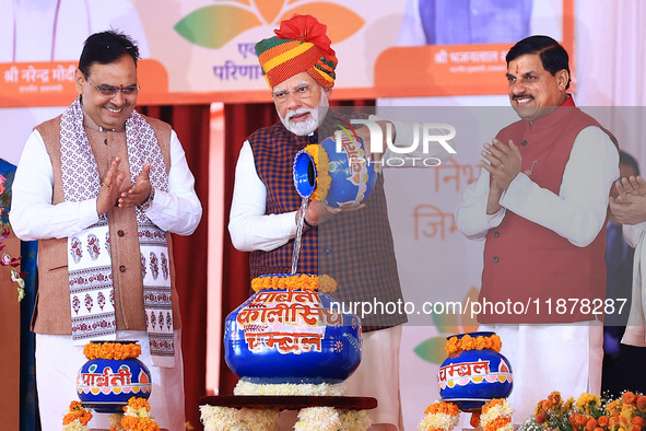 Prime Minister Narendra Modi is with Rajasthan Chief Minister Bhajan Lal Sharma and Madhya Pradesh Chief Minister Mohan Yadav during the 'Ek...