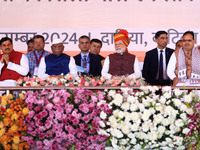 Prime Minister Narendra Modi is with Rajasthan Chief Minister Bhajan Lal Sharma, Rajasthan Governor Haribhau Bagade, and Madhya Pradesh Chie...