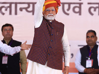 Prime Minister Narendra Modi greets the gathering during the 'Ek Varsh-Parinaam Utkarsh' event, marking the completion of one year of the Ra...