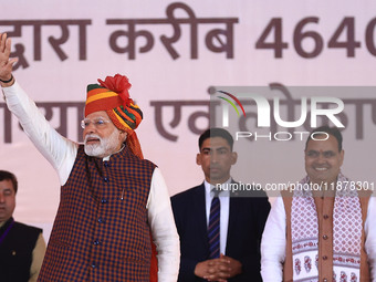 Prime Minister Narendra Modi greets the gathering during the 'Ek Varsh-Parinaam Utkarsh' event, marking the completion of one year of the Ra...