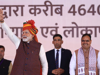 Prime Minister Narendra Modi greets the gathering during the 'Ek Varsh-Parinaam Utkarsh' event, marking the completion of one year of the Ra...