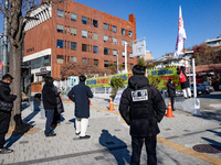 Members of the National Transformation Promotion Committee of Hell Joseon display a flag calling for the president's resignation on the side...