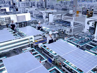 A worker produces solar photovoltaic products at a digital workshop in Suqian, Jiangsu province, China, on December 17, 2024. (