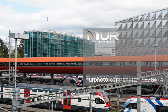 The bustling Geneva railway station in Geneva, Switzerland, on April 1, 2024, features sleek trains.   