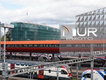 The bustling Geneva railway station in Geneva, Switzerland, on April 1, 2024, features sleek trains.   (