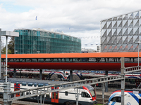 The bustling Geneva railway station in Geneva, Switzerland, on April 1, 2024, features sleek trains.   (