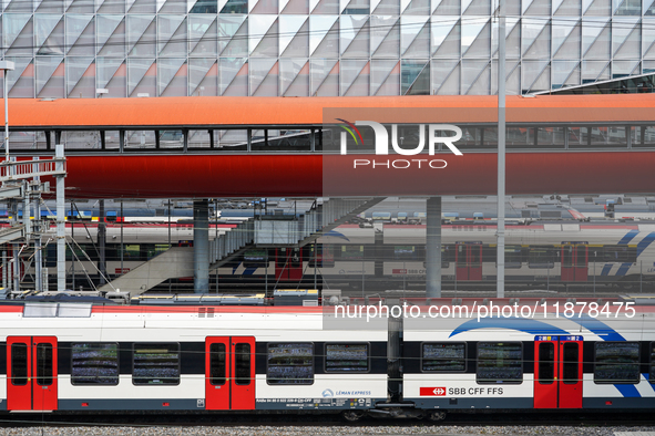 The bustling Geneva railway station in Geneva, Switzerland, on April 1, 2024, features sleek trains.   