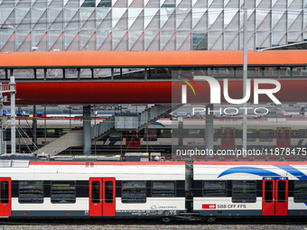 The bustling Geneva railway station in Geneva, Switzerland, on April 1, 2024, features sleek trains.   (