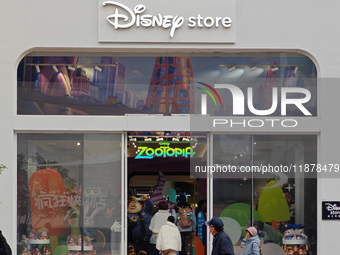 Customers shop at a newly opened Disney store on Nanjing Road Pedestrian Street in Shanghai, China, on December 18, 2024. (