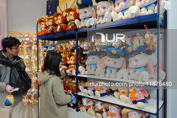 Customers shop at a newly opened Disney store on Nanjing Road Pedestrian Street in Shanghai, China, on December 18, 2024. 