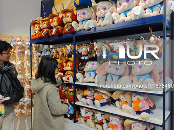 Customers shop at a newly opened Disney store on Nanjing Road Pedestrian Street in Shanghai, China, on December 18, 2024. (