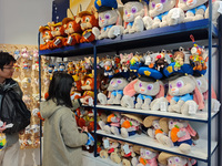 Customers shop at a newly opened Disney store on Nanjing Road Pedestrian Street in Shanghai, China, on December 18, 2024. (