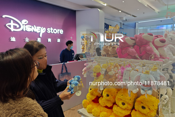 Customers shop at a newly opened Disney store on Nanjing Road Pedestrian Street in Shanghai, China, on December 18, 2024. 