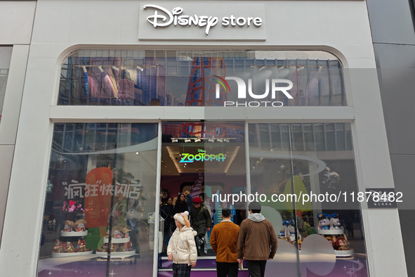 Customers shop at a newly opened Disney store on Nanjing Road Pedestrian Street in Shanghai, China, on December 18, 2024. 