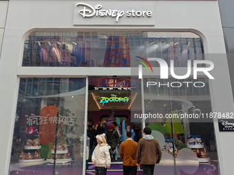 Customers shop at a newly opened Disney store on Nanjing Road Pedestrian Street in Shanghai, China, on December 18, 2024. (