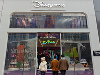 Customers shop at a newly opened Disney store on Nanjing Road Pedestrian Street in Shanghai, China, on December 18, 2024. (