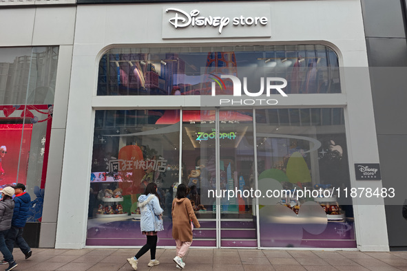 Customers shop at a newly opened Disney store on Nanjing Road Pedestrian Street in Shanghai, China, on December 18, 2024. 