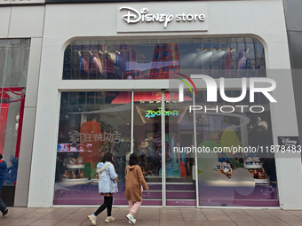 Customers shop at a newly opened Disney store on Nanjing Road Pedestrian Street in Shanghai, China, on December 18, 2024. (