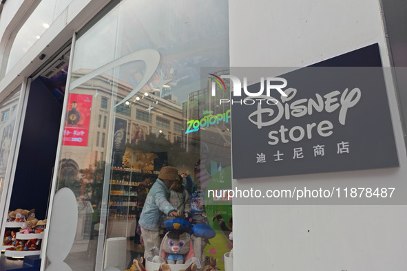 Customers shop at a newly opened Disney store on Nanjing Road Pedestrian Street in Shanghai, China, on December 18, 2024. 