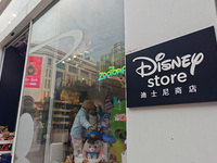 Customers shop at a newly opened Disney store on Nanjing Road Pedestrian Street in Shanghai, China, on December 18, 2024. (