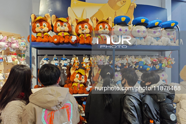 Customers shop at a newly opened Disney store on Nanjing Road Pedestrian Street in Shanghai, China, on December 18, 2024. 