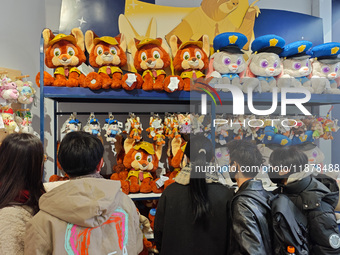 Customers shop at a newly opened Disney store on Nanjing Road Pedestrian Street in Shanghai, China, on December 18, 2024. (