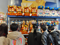 Customers shop at a newly opened Disney store on Nanjing Road Pedestrian Street in Shanghai, China, on December 18, 2024. (