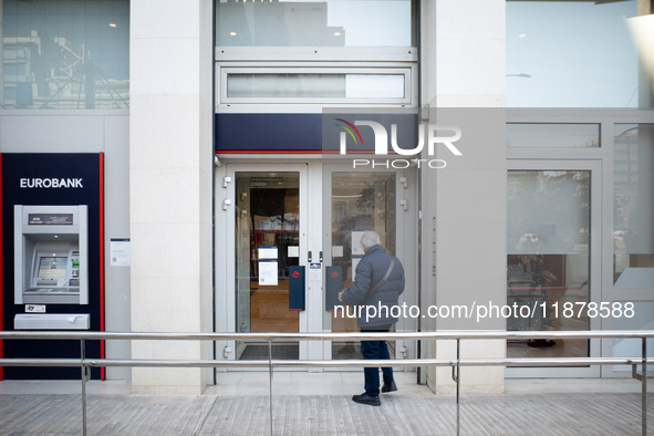 A Eurobank Bank branch is in Athens, Greece, on December 18, 2024. Greek lenders face an impact of about 350 million euros ($368 million) in...