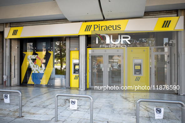 A Piraeus Bank SA branch is in Athens, Greece, on December 18, 2024. Greek lenders face an impact of about 350 million euros ($368 million)...