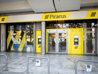 A Piraeus Bank SA branch is in Athens, Greece, on December 18, 2024. Greek lenders face an impact of about 350 million euros ($368 million)...