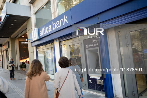 An Attica Bank branch is in Athens, Greece, on December 18, 2024. Greek lenders face an impact of about 350 million euros ($368 million) in...